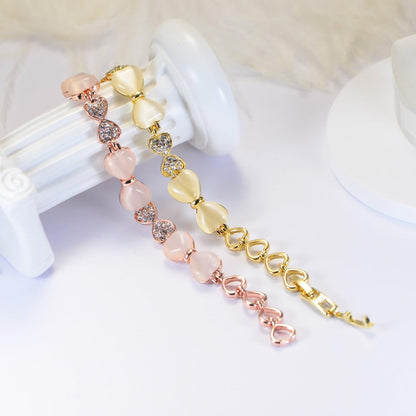 ハート＆リボンの猫目石ブレスレット｜ジルコニア×ローズゴールド＆ゴールド