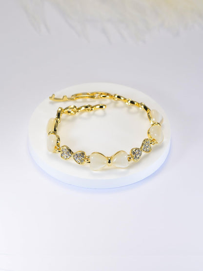 ハート＆リボンの猫目石ブレスレット｜ジルコニア×ローズゴールド＆ゴールド