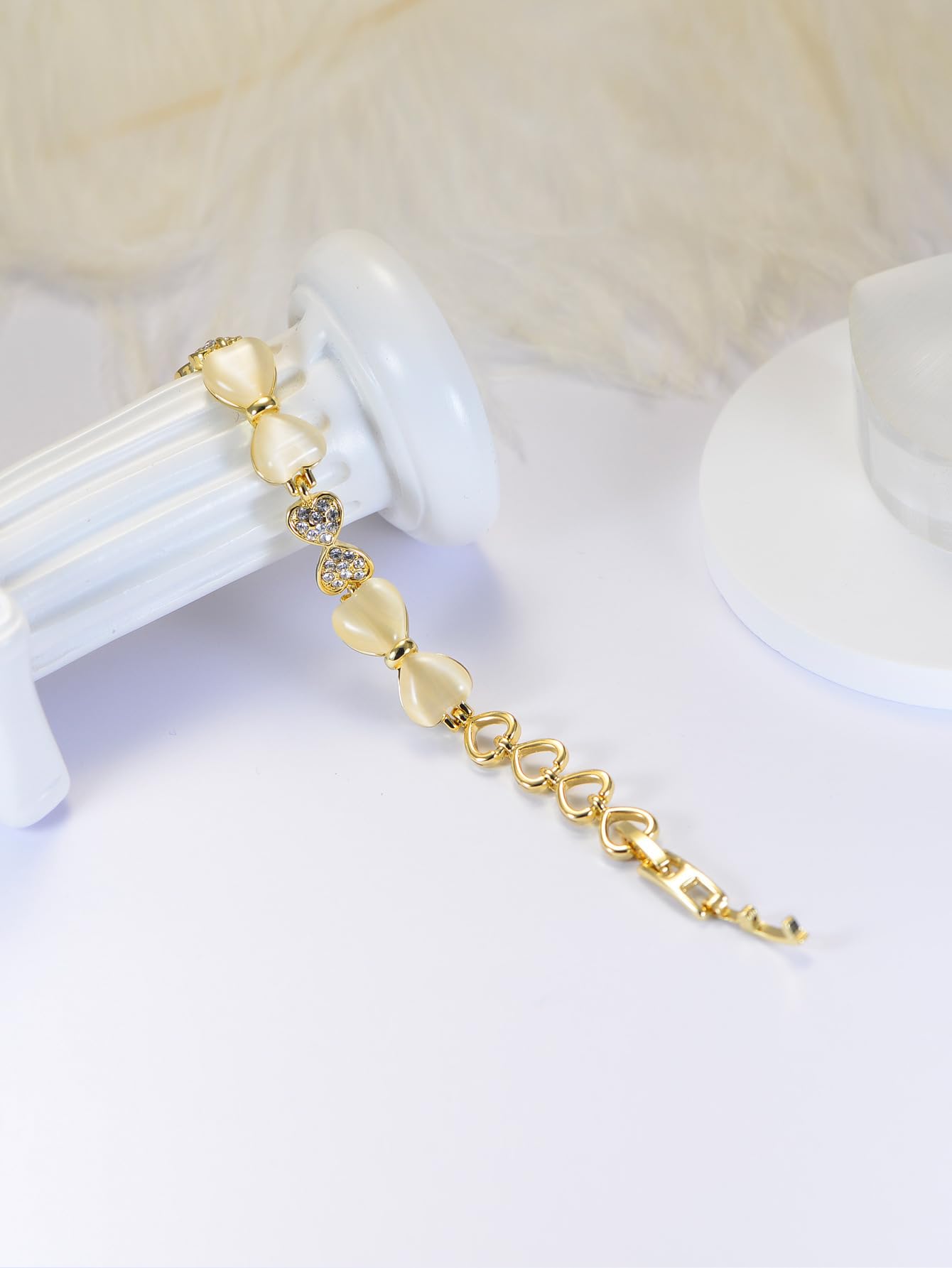 ハート＆リボンの猫目石ブレスレット｜ジルコニア×ローズゴールド＆ゴールド