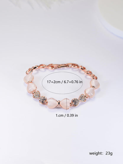 ハート＆リボンの猫目石ブレスレット｜ジルコニア×ローズゴールド＆ゴールド