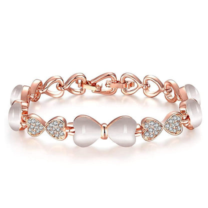 ハート＆リボンの猫目石ブレスレット｜ジルコニア×ローズゴールド＆ゴールド